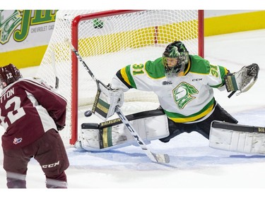 London Knight goalie can't quite stretch enough to stop  the Peterborough Petes first goal of the game by Dustin Hutton  in London, Ont. on Saturday September 21, 2019. Derek Ruttan/The London Free Press/Postmedia Network