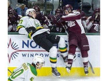 London Knight Kirill Steklov collides with Brady Hinz of the Peterborough Petes during the first period of their game at Budweiser Gardens  in London, Ont. on Friday September 20, 2019. Derek Ruttan/The London Free Press/Postmedia Network