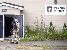 A member of the RCMP outside the Sicilia Club of London at 923 Commissioners Road East in London, Ont. on Monday September 23, 2019. The RCMP executed a search warrant at the property during a drugs investigation with the help of London Police, OPP and London Fire Department. Derek Ruttan/The London Free Press/Postmedia Network