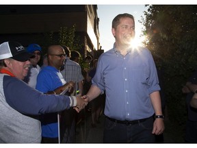 Progressive Conservative leader Andrew Scheer greats supporters while leaving a rally at the Crabby Joe's restaurant on Oxford Road at Capulet Lane in London, Ont. on Tuesday September 24, 2019. (Derek Ruttan/The London Free Press)