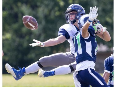 Parkside Stampeders receiver Cole Moore makes a valiant attempt but can’t quite make the Odell Beckham Jr.-like catch while covered by Cole Manier of the Laurier Rams in TVRA action in London on Thursday. (Derek Ruttan, The London Free Press)