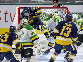 Knights forward Josh Nelson checks Erie Otters' Connor Lockhart into the net behind London goalie Brett Brochu during the first period of their OHL game at Budweiser Gardens in London, Ont. on Friday September 27, 2019. Derek Ruttan/The London Free Press/Postmedia Network