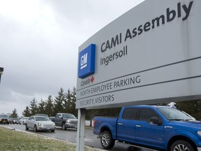 Workers stream out of the CAMI plant in Ingersoll. (Free Press files)