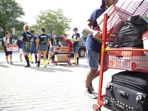 Sophs help frosh move into Western University's Essex Hall residence in London on Monday September 3, 2018. (Free Press file photo)