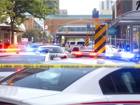 A man with a knife was apprehended on King Street just east of Richmond on Tuesday September 3, 2019.  A police officer fired two shots at the suspect but no one was injured. (Mike Hensen/The London Free Press)