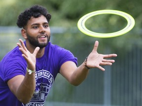 Ron Peter of Windsor, a first-year kinesiology student at Western University, reaches for a disc as he plays some catch with other frosh on campus as part of orientation at Western University in London, Ont.  Photograph taken on Tuesday September 3, 2019.  Mike Hensen/The London Free Press/Postmedia Network