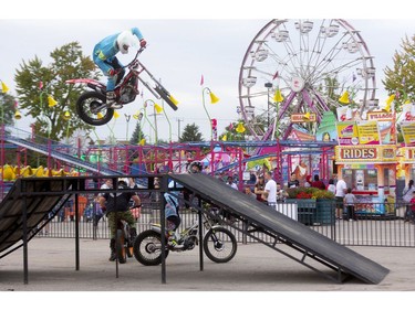 Australian Sam King of Ride the Vibe performs on his motorcycle at the Western Fair's opening day on Friday. (Mike Hensen/The London Free Press)