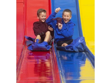 It was a fight to the finish for twin brothers Jack and Cole Branston, 14, of London at the Western Fair's opening day on Friday. The two grabbed and pulled and pushed and laughed all the way down the big slide before Cole eked out a slight win. (Mike Hensen/The London Free Press)