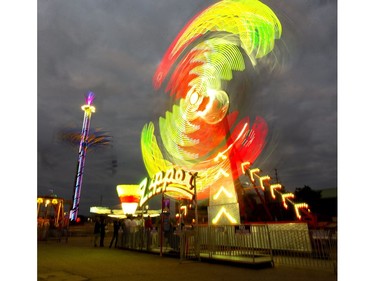 The iconic Zipper ride does its thing on opening night at the Western Fair in London. (Mike Hensen/The London Free Press)