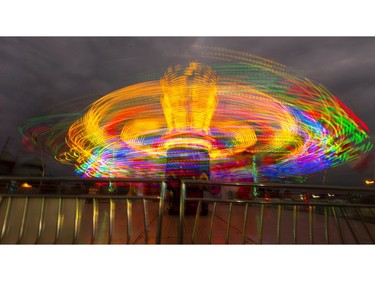 The super-fast ride Re-Mix Power does it thing on opening night at the Western Fair in London. (Mike Hensen/The London Free Press)