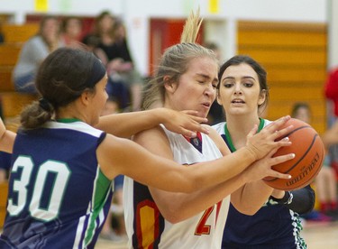 Julianna Rizzo of the Saunders Sabres runs into a double team against Laurier's Sarah Stanton and Kayla Khattar during their TVRA Central senior girls basketball game at Saunders on Monday September 30, 2019. 
Laurier dominated throughout with a good press and defence that forced the Sabres to cough up a lot of turnovers.
Mike Hensen/The London Free Press/Postmedia Network