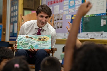 Prime Minister Justin Trudeau reads Why I Love Canada to a group of grade 1 and 2 pupils at Blessed Sacrament Catholic elementary school on Sept. 16 during a campaign stop in London. (MAX MARTIN, The London Free Press)
