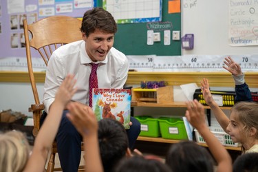 Prime Minister Justin Trudeau reads Why I Love Canada to a group of grade 1 and 2 pupils at Blessed Sacrament Catholic elementary school on Sept. 16 during a campaign stop in London. (MAX MARTIN, The London Free Press)