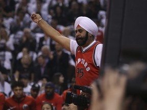 Toronto Raptors "superfan" Nav Bhatia leads the charge during the first quarter in Toronto, Ont. on Wednesday April 25, 2018. (Jack Boland/Postmedia Network)