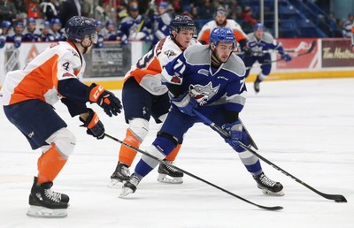Forward Jacob Collins of the Flint Firebirds places a hit against News  Photo - Getty Images
