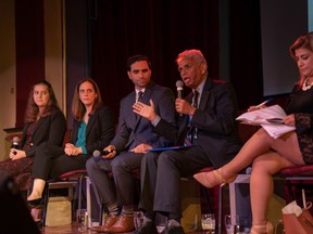 Liberal candidate Peter Fragiskatos and People's Party of Canada candidate Salim Mansur exchange words early in the debate, with Mansur saying Fragiskatos "doesn't know much." Fragiskatos said he would keep the debate civil. (Max Martin, The London Free Press)