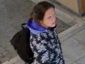 London police have published this image of a suspect after a woman tried to set two vehicles on fire at an east London fast food restaurant.