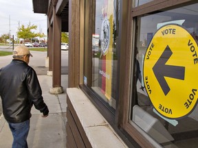 Voters head to a polling station in Brantford for Monday's federal election. How well did the outcome actually reflect the way Canadians voted?
