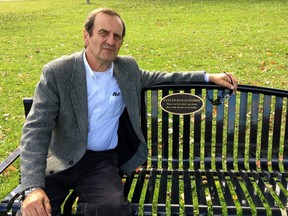 Joseph Kubat sits on a bench honouring the memory of his sister, Evelyn Sophia Harris, who died in hospital after a hit-and-run crash in the Stratford Walmart parking lot. (Handout)