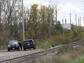 A body was discovered in a wooded area in the northwest portion of Exeter at 4:15 p.m. on Oct. 21. Above are OPP vehicles and a taped off area at the train tracks just south of Thames Road West. While the identity of the body has still not been confirmed, OPP have said foul play was not involved. Scott Nixon