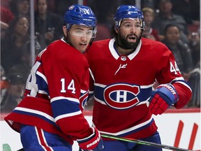 Montreal Canadiens' Nick Suzuki, left, and Nate Thompson follow the play during third period against the San Jose Sharks in Montreal on Oct. 24, 2019.