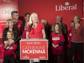 Liberal Catherine McKenna celebrates her win on election night. Days later, an image of her on the window of her campaign headquarters was spray-painted with foul language.