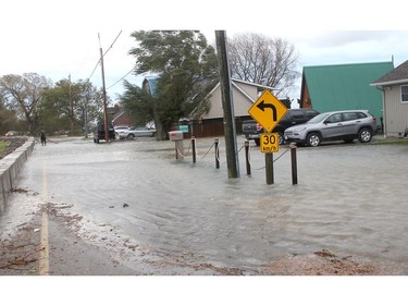 Sections of Erie Shore Drive near Erieau were flooded on Sunday October, 27, 2019 after powerful send waves crashing over breakwalls and other flood protection infrastructure. (Ellwood Shreve/Postmedia Network)