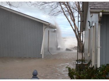 Sections of Erie Shore Drive near Erieau were flooded on Sunday October, 27, 2019 after powerful send waves crashing over breakwalls and other flood protection infrastructure. (Ellwood Shreve/Postmedia Network)