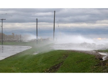Gale-force winds were sending waves crashing over Erieau Road on the edge of Erieau Ont. on Sunday October 27, 2019. (Ellwood Shreve/Postmedia Network)