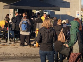 People line up outside Silverwood Arena in east London, where city hall is hosting its first-ever Housing Stability Week, a blitz aiming to find housing for people dealing with homelessness. (JONATHAN JUHA, The London Free Press)