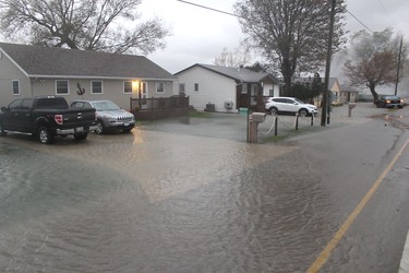 Sections of Erie Shore Drive near Erieau were flooded on Sunday October, 27, 2019 after powerful waves were sent crashing over breakwalls and other flood protection infrastructure. (Ellwood Shreve/Postmedia Network)