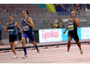 Damian Warner of London, right, competes in the men's decathlon 400 metres during the 17th IAAF World Athletics Championships Doha, Qatar, on Tuesday. Warner finished fifth in a time of 48.12 seconds.