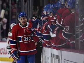 Montreal Canadiens forward Nick Suzuki, a London native, reacts with teammates after scoring a goal against the Minnesota Wild during the first period at the Bell Centre. It is Suzuki s first NHL goal. (Eric Bolte-USA TODAY Sports)