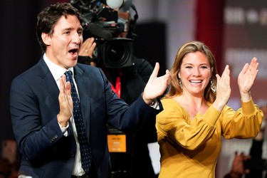 Liberal leader and Canadian Prime Minister Justin Trudeau and his wife Sophie Gregoire Trudeau clap on stage after the federal election at the Palais des Congres in Montreal, Quebec, Canada October 22, 2019. REUTERS/Carlo Allegri ORG XMIT: CRA307