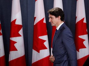 Canada's Prime Minister Justin Trudeau leaves the stage after speaking to the news media for the first time since winning a minority government in the federal election, at the National Press Theatre in Ottawa, Ontario, Canada October 23, 2019. REUTERS/Stephane Mahe