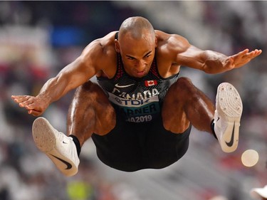 London's Damian Warner competes in the long jump of the men's decathlon at the World Athletics Championships in Doha, Qatar, on Tuesday. His jump 
of 7.67 metres placed him second.