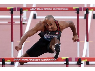 Canada's Damian Warner in action at the World Athletics Championships in Doha, Qatar, on Wednesday.

110-metre hurdles: 13.56, first