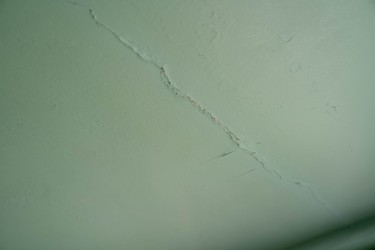 The ceiling in Bess Srahulek's house on Broughdale Avenue shows signs of cracking after last weekend's unsanctioned FoCo street party. Police told her three people climbed on her roof during the party. A group of Western University students have set up a GoFundMe campaign to cover the cost of repairs. (Max Martin, The London Free Press)