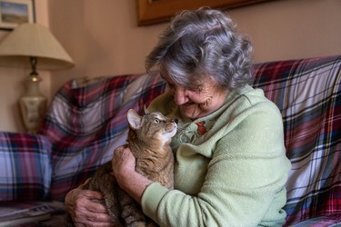 Bess Srahulek, 89, had to leave her home on Broughdale Avenue with her cat Thomas and stay at a hotel during last weekend's FoCo street party. Her house was damaged while she was away, but some students are fundraising to cover the cost of repairs. (Max Martin, The London Free Press)