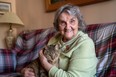 Bess Srahulek, 89, had to leave her home on Broughdale Avenue with her cat Thomas and stay at a hotel during last weekend's FoCo street party. Her house was damaged while she was away, but some students are fundraising to cover the cost of repairs. (Max Martin, The London Free Press)