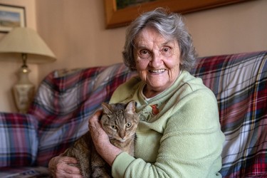 Bess Srahulek, 89, had to leave her home on Broughdale Avenue with her cat Thomas and stay at a hotel during last weekend's FoCo street party. Her house was damaged while she was away, but some students are fundraising to cover the cost of repairs. (Max Martin, The London Free Press)