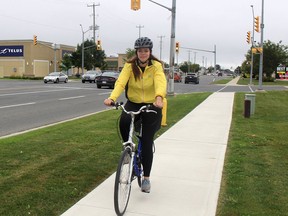 Dominique Holley, 29, of Toronto, was in Chatham on Wednesday as part of her 1,100 kilometre Be The One bicycle tour to raise awareness about human trafficking that began in Windsor on Tuesday and will end in Ottawa on Oct. 31. Ellwood Shreve/Chatham Daily News/Postmedia Network