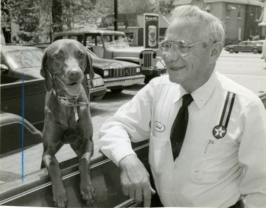 Gord Gorrie, owner of Gord's Circle Service in London with his dog Tami, plans to retire, 1988. (London Free Press files)