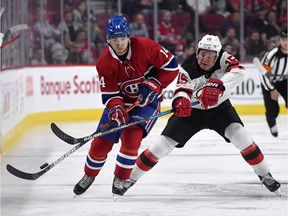 Canadiens forward Nick Suzuki plays the puck during pre-season game against the Devils last month. Suzuki is one of two rookies breaking camp with the team.