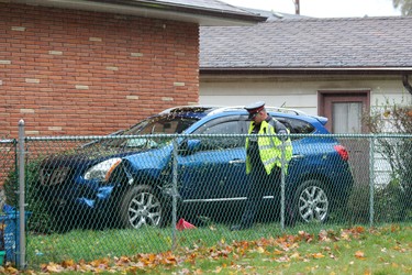 An SUV travelling south on Taylor Street collided with a parked car before crossing Cheapside Street and coming to a stop against a home on Thursday, Oct. 31, 2019. DALE CARRUTHERS / THE LONDON FREE PRESS