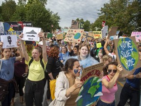 Climate change protesters flooded Wellington Street before marching west on Dufferin Avenue in London. Derek Ruttan/The London Free Press