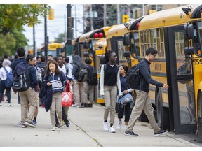 CCH students board buses after school on Friday. (Derek Ruttan/The London Free Press)