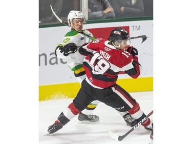 Ottawa 67 Jack Beck gets away with a high stick to the neck of London Knight Nathan Dunkley during the first period of their OHL hockey game in London on Friday. (Derek Ruttan/The London Free Press)