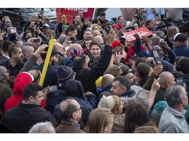 Liberal Party leader Justin Trudeau wades through a sea of supporters during a campaign stop at the campaign office of  London-Fashawe candidate Mohamed Hammoud in London, Ont. on Monday October 14, 2019. .Derek Ruttan/The London Free Press/Postmedia Network