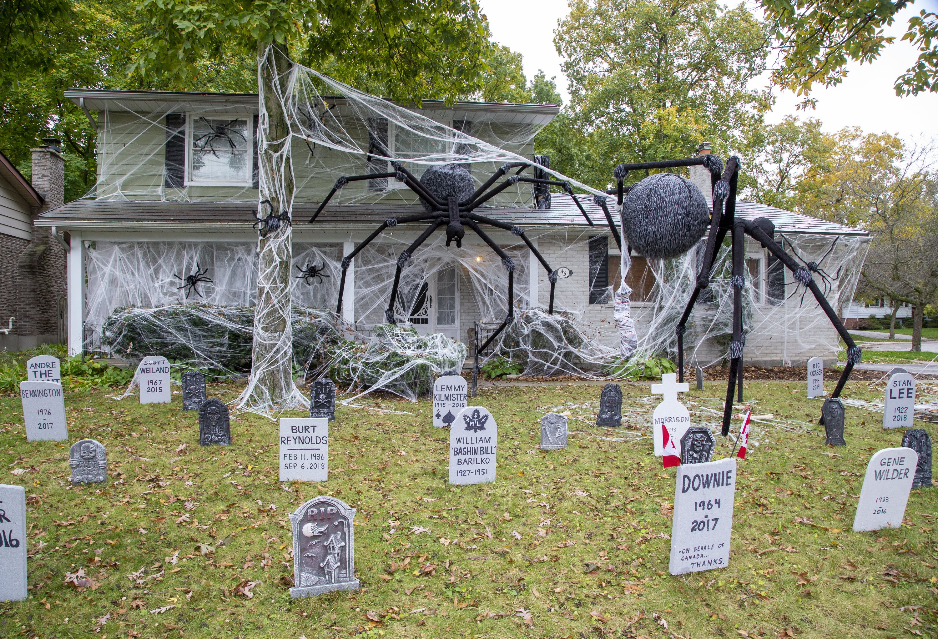 Decorations of large spiders and celebrity tombstones at 45 Blue Ridge Cres., are a labour of love for Dan Earle. (DEREK RUTTAN, The London Free Press)